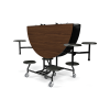 60 inch round folding lunchroom table in Montana walnut laminate with 8 black stool seats and commercial rolling steel frame in upright storage