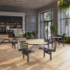 36 inch round Covey indoor Cluster Table with Fusion Maple HPL top, black powder-coated steel frame, and four black wood seats in commercial café setting