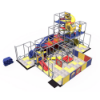 Opposite angle view of indoor playground featuring multi-level climbing decks, tube slides, and interactive play elements