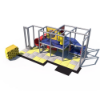 Discovery Den indoor playground front view with enclosed tube slide, elevated platform, activity panels, and commercial safety flooring