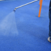 Applying spray coat to poured in place rubber playground surface for maintenance and extended durability in high traffic areas