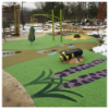 Custom poured in place rubber playground surfacing with colorful design patterns for themed and inclusive play environments