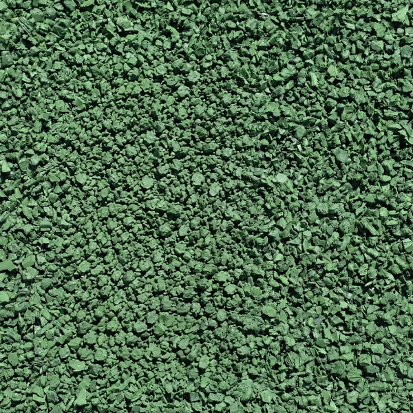 Green rubber mulch playground surfacing material in a 2000 lb bulk bag for commercial playground safety areas